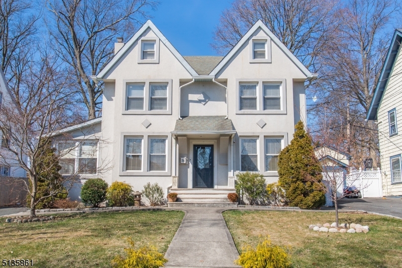 An absolute charmer that's completely move-in ready! This center hall Colonial style home is located in the desirable Berkeley section just minutes to mass transportation, including midtown direct NJ Transit train and Light Rail stations   a commuter's dream! First floor features original quarter sawn oak flooring, living room with wood burning fireplace, dining room, all seasons room and kitchen with stainless steel appliances and granite countertops. As you ascend to the second floor, you are adorned with a bonus sun room complete with windows allowing tons of natural light overlooking the backyard, 3 generous sized bedrooms, of which 2 have large built-in window benches w/storage, and a luxurious marble bathroom with adjoining separate original soaking clawfoot tub and marble shower. Third floor offers a wide landing leading to 2 additional bedrooms, which are not to be missed. Enjoy endless hours of entertaining and relaxation in your own private outdoor oasis offering a cedar pergola and a swim spa hot tub! Full finished basement with a half bath, washer/dryer and plenty of storage. Two car garage with a four-car driveway. Nest security cameras. Fireplace AS IS with no known issues.