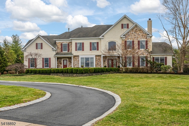 Set on more than two acres, this expansive home pairs luxury and leisure with ease. Inside, beautifully proportioned rooms include a dramatic family room with soaring windows and a wood-burning fireplace, a gracious living room with a gas fireplace, an airy conservatory, a den, and a sunlit kitchen with high-end appliances and a large island at its center. Outdoor living is equally inviting with a paver patio, outdoor kitchen, pool, spa, and fenced grounds. Upstairs, the main suite is a true sanctuary with three walk-in closets, a kitchenette, bathroom, and a home office. Two more bedrooms share a Jack-and-Jill bathroom, while the guest suite has its own bathroom. A home theater, gym, recreation room, full bath, and wine cellar create a destination all their own in the walk-out lower level.