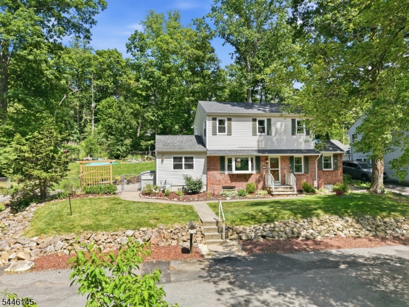 Welcome home to this beautifully updated 3 bedroom, 1.5 bath colonial! Tucked away in a quiet neighborhood, this home gives you great charm and lots of privacy, sitting right across the street from acres of woods. Inside, you can see the amazing care and updates throughout the house. An inviting foyer welcomes you, leading into a large living room, a formal dining room, a half bath, and a handy mudroom/laundry room combination. The heart of the home is the fully remodeled custom kitchen. It features beautiful granite countertops, stainless steel appliances, soft-close cabinets, and smooth hardwood floors that flow right into the dining room. Upstairs, you will find all 3 bedrooms, including a primary bedroom with an impressive closet. There is also plenty of storage space throughout the home. All the expensive updates are already done for you: new furnace (2025), 2 zone central AC (2021), water heater (2021), roof (2020), and updated flooring in the living room, bedrooms, stairs, and hallway (2021). Outside is a dream for anyone who loves nature! You can relax on the patio, enjoy the fully fenced-in yard, or hang out near your very own stream surrounded by quiet woods. This move-in ready home is a perfect peaceful retreat!