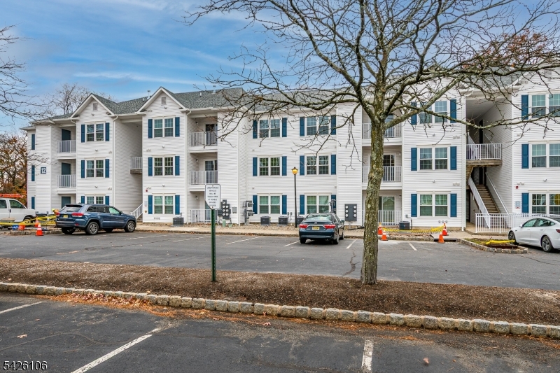 Brand new beautifully rebuilt 2-bedroom, 2-bath condominium offering approximately 1,034 sq. ft. of modern, move-in-ready living in the desirable Waterford community in Edison. This unit was part of a complete Building 12 reconstruction, featuring a brand-new interior throughout including new flooring, walls, windows, doors, plumbing, electrical, and HVAC systems. The bright open layout features a modern kitchen with quartz countertops, stainless steel appliances, contemporary cabinetry, and matching backsplash, opening seamlessly to the living and dining area. The primary bedroom includes a fully updated private bath and generous closet space, while the second bedroom offers flexibility for guests, home office, or additional living space. Both bathrooms feature modern finishes and updated fixtures. Additional features include in-unit washer and dryer, recessed lighting, updated mechanical systems, and a private balcony with wooded views and storage. Residents enjoy community amenities including a swimming pool, playground, and ample parking. Conveniently located near major highways, shopping, dining, and NJ Transit train stations in Edison and Metuchen, offering convenient commuting and access to everyday amenities.