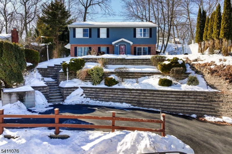 Welcome to this beautifully maintained home in the heart of desirable White Meadow Lake, offering comfort, updates, and an exceptional lifestyle including clubhouse, beaches, and pools! The main level features a recently renovated kitchen with white cabinetry, granite countertops, stainless steel appliances, and a tiled backsplash, along with a renovated main bath (2018).  Three bedrooms are on the 2nd floor and one is on the 1st floor.  The lower level offers flexible living space with a foyer entry, a spacious family room currently used as a primary bedroom with a large front window and cozy wood-burning stove, an additional bedroom (currently a workout room), a bonus room, and a second bathroom. Enjoy a private backyard oasis with a large deck, portable hot tub, firepit, natural surroundings, a large storage shed, and an underground sprinkler system. An energy-efficient furnace adds year-round comfort. Conveniently located near major highways, shopping, and schools just unpack and enjoy all that White Meadow Lake has to offer! Annual lake fee require for 2026 -$970, one time closing fee $1,200.
