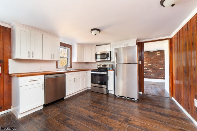 WHY RENT WHEN YOU CAN OWN!!! 2 Bedroom 1 bath ranch with bonus office and den on quiet dead end street in the Lake Neepaulin section of Wantage township where you can enjoy fishing, boating, and swimming. Home features brand new flooring, cabinets, countertops and stainless steel appliances.