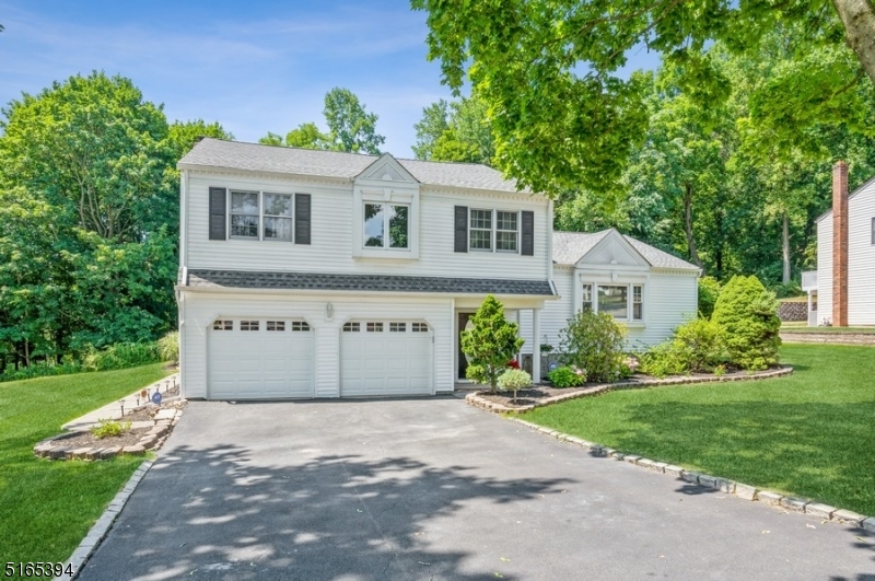 Stylish, modern home in a prime location! Beautiful Split-Level home with 4Bd/2 1/2 Bth, and a 2-car attached garage is situated on a landscaped lot in Cedar Knolls, a quiet community within desirable Hanover Township. With easy access to RT-287, this home is near shopping, dining, several parks, and the Morris County Golf Club. The exterior of this well-maintained property offers great entertaining opportunities with an oversized sparkling in-ground swimming pool, a large deck with a retractable awning, and a lush back yard lawn framed by mature trees and woods beyond. Inside, the main level boasts a bright, open space with hardwood floors encompassing the living room, dining area, and kitchen. From the dining room, oversized sliding glass doors open to the SS appliances including a modern exhaust hood over the range, and a large breakfast bar with tons of storage. The ground level includes a powder room, laundry room, and a family room centered by a wood-burning fireplace set into a natural stone wall surround. The fabulous pool room is perfect for entertaining with sliders opening directly to the pool patio. The second floor offers a primary bedroom suite with a private bathroom and walk-in closet, three additional bedrooms, and a full hallway bathroom. A recreation room in the finished basement level completes the layout of this move-in ready home.