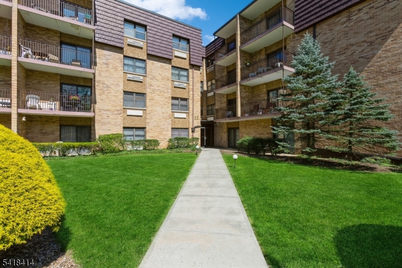 This one of a kind Cranford condo offers the perfect low-maintenance lifestyle. Enjoy easy one-floor living in an elevator building with a laundry room on every floor, just 0.5 miles from downtown Cranford and NYC transportation.This 2 bedroom, 2 full bath unit features an open-concept living and dining area, updated kitchen with white cabinetry and stainless steel appliances, new windows with custom shades, and a newer heating and cooling unit. The primary suite bath includes a universal design wet-room shower, and a spacious second bedroom with double closet sits near the full hall bath.Solid concrete construction provides exceptional sound insulation, creating a quiet and peaceful living environment.A rare bonus: DEEDED GARAGE PARKING, plus additional parking in the private lot.Set on a quiet, park-like one-way street with scenic views near Sperry Park, Cranford Canoe Club, Hanson Park Conservancy, and Nomahegan Park. Ideal for downsizers or NYC buyers seeking convenience and tranquility.