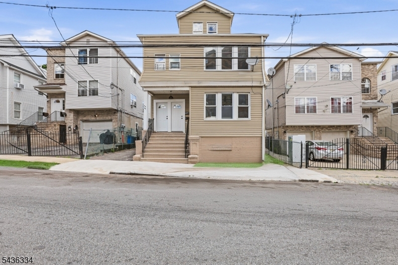 Welcome to 235-237 Lehigh Ave, a beautifully renovated 2-family home offering expansive living space, modern finishes, and exceptional multi-family appeal in Newark's desirable Weequahic section. The first unit features four spacious bedrooms and two full bathrooms, highlighted by a welcoming foyer/sitting area, an open Living/Dining Room layout, and a beautifully updated kitchen with quartz countertops, stainless steel appliances, and contemporary finishes. The primary bedroom includes its own private full bathroom for added comfort and convenience. The second unit offers an impressive five-bedroom, three-bathroom layout, including a primary bedroom with its own private full bath. This unit also features a bonus third-floor living space complete with an additional bedroom and full bathroom, providing excellent flexibility for a home office, recreation space, storage, or everyday use. Both units offer bright, open layouts designed for comfortable living and entertaining. An unfinished basement provides additional storage potential, while the detached two-car garage and driveway accommodate parking for up to six vehicles. With a total of nine bedrooms and five full bathrooms, this move-in-ready property offers space, style, and incredible versatility for homeowners and investors alike. Grab it before it's gone!