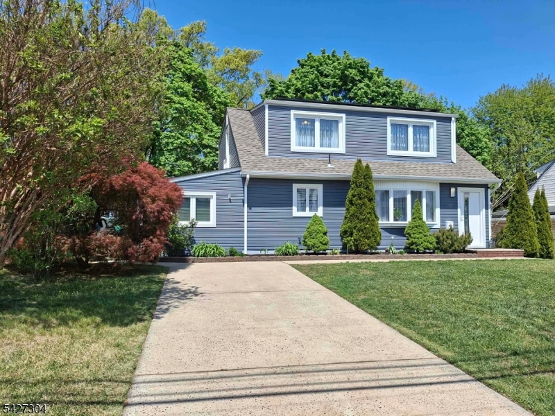 EXCEPTIONAL CUSTOM HOME all redone: Set on 55x100 private, beautifully landscaped yard in one of Parlin's most coveted neighborhoods, this Colonial blends timeless elegance w/ modern comfort. Offering 4 bedrooms & 2 full baths, the home is filled w/ natural light & enhanced by recessed ceilings lights, exquisite decorative details. A chef's gourmet kitchen, appointed w/ granite countertops & top-tier appliances, custom cabinetry & an additional breakfast table area which seamlessly opens to direct access to the patio & backyard backing to woods--creating the perfect setting for effortless indoor-outdoor entertaining. Designed for both everyday living & refined hosting, the home also features a warm & inviting living room and a formal dining room, & a cozy bonus room. A newly finished baths are additional bonus along w/ abundant storage, completing this thoughtfully designed residence.Close to NYC bus,train, main roads,shopping plazas, and Kennedy Park offering tennis courts,playgrounds,Pickleball courts,walking paths along the lakes,this home offers a rare opportunity to enjoy a premier location.