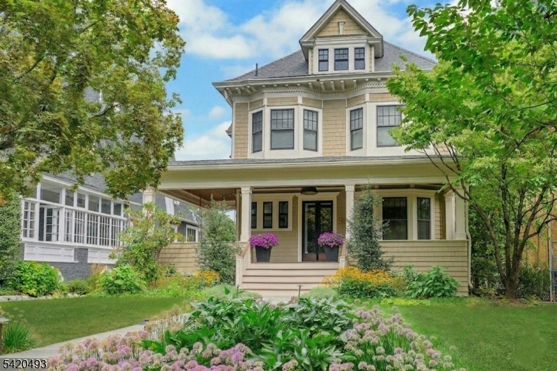 Welcome to 59 Hobart Ave., a thoughtfully updated home rich in architectural detail offering an open layout, high ceilings, and an exceptional Summit location. The first floor features a seamless flow between the living, dining, kitchen and family room areas ideal for both everyday living and entertaining. The kitchen opens to a large deck overlooking the flat backyard, creating an easy indoor-outdoor flow. Fireplaces in both the dining room and family room add warmth and character, while abundant natural light enhances the home's airy feel. Upstairs, two newly renovated designer bathrooms elevate the second level, including a stylish primary bath with dual sinks and oversized shower and a hall bath serving the additional bedrooms. The third floor offers wonderful flexibility with two additional rooms ideal as bedrooms, a home office, or a combination of both. The lower level offers a recreation room, a bedroom, and full bath, perfect for guests or extended living. An idyllic front porch provides a welcoming place to relax and enjoy the neighborhood, while the property's location is truly outstanding, approximately 0.4 miles to the Summit NJ Transit train station for convenient access to NYC. Situated near the highly regarded Lincoln-Hubbard Elementary School and Summit Middle School, this home combines comfort, style, and convenience in one of Summit's most desirable neighborhoods. 59 Hobart Avenue is a wonderful opportunity to enjoy modern living with timeless appeal.