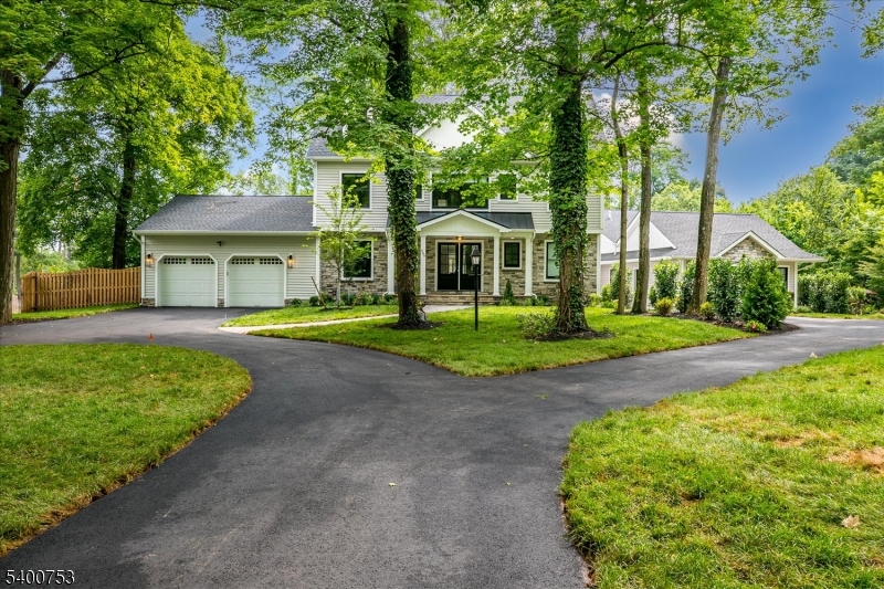 Magnificently reconstructed Colonial in2025  located in a prime, highly sought neighborhood. Absolutely new throughout finished with the best of everything. This is a stunning showcase of thoughtful design, luxe finishes and superior craftsmanship-inside and out. Step inside to discover hardwood floors throughout, crown moldings and recessed lighting are abundant. The foyer opens to a formal Dining Room on the left, while straight ahead, the expansive Great Room and kitchen invite effortless entertaining and everyday comfort. A gas fireplace with a marble surround is the visual anchor for the Great Room. The window lined Breakfast area with sliding doors opens to a covered patio with ceiling fan, ideal for warm weather dining.The gourmet kitchen is beautiful, functional and loaded with high end amenities and Viking appliances. A hallway off the kitchen includes a convenient bench and cubby system for jackets, shoes and backpacks, while a private first floor office overlooks the fully fenced rear yard. The upstairs bedrooms and baths create a symphony of elegance and timeless quality.The fully and beautifully finished basement expands both living space and endless options as it includes a full bath.The beautiful and separately owned accessory dwelling unit (ADU) enjoys its own fully fenced yard and private driveway, with a shared driveway apron where the two drives meet the road. This listing is for the main home only.
