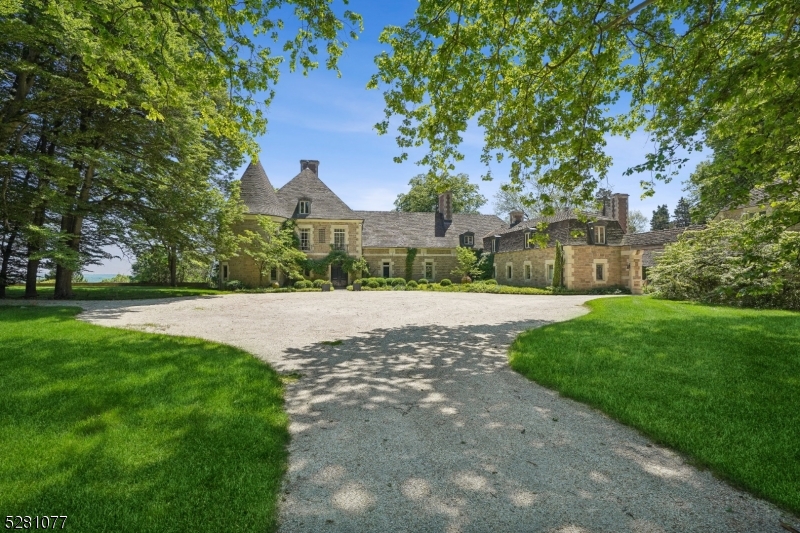Truly once in a lifetime opportunity to own a one of a kind spectacular estate that is the ultimate in privacy. This spectacular Magazine worthy 46 acre Estate transports you to the South of France! You've never seen anything like it! Stunning original features abound in rooms of grand proportion, soaring vaulted & beamed ceilings, massive fireplaces,  and great natural light from floor to ceiling arched French doors and new Pella windows. Totally renovated to perfection with gourmet eat-in kitchen with top of the line appliances, Subzero refrigerator/freezer, Viking range and Viking dishwasher, and luxurious new bathrooms found in 5-star hotels. You'll love the breathtaking Primary Suite with fireplace, pair of French doors open to Juliet Balcony, walk-in dressing room plus 2 spa-like bathrooms. Also has a first floor guest/in-law suite and an apartment for a caretaker about the 4-car detached garage. Built in 1935, was designed by Adams & Prentice for the late Henry R. Luce and his wife, Lila. Mr. Luce was the founder of Time and Life Magazines. Sycamore, a refined country estate, is finished with limestone and washed aggregate blocks, capped by a tile roof. Manicured surroundings are enhanced by a walled serpentine garden & formal boxwood garden and reflecting pond, all with impressive views of the Somerset Hills. A landmark residence with an impressive history. Farmland Preservation easement so low Taxes.