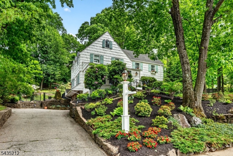 Welcome to the Afterglow Section, one of Verona's most sought-after locations, where this timeless Colonial's charm meets exceptional convenience and lifestyle. Perfectly positioned just one block from the breathtaking 400+ acre Eagle Rock Reservation, this sun-drenched residence offers gracious living spaces, thoughtful updates, and an unbeatable setting. Filled w/natural light, the home features expansive rooms throughout, including a welcoming Living Rm w/fpl , spacious Fam Rm, and an updated kitchen designed for both everyday living + entertaining w/peninsula, center island, + separate Breakfast Rm. A private 3-season porch provides the perfect place to unwind while taking in stunning sunset views. The 2nd floor offers 3 spacious bedrooms and 3 full baths, plus a serene Primary Suite complete w/ fpl and updated bath. The 3rd floor provides a private retreat w/additional large bedroom, full bath, and abundant storage ideal for guests, home office, or flexible living space.The finished lower level adds exceptional versatility w/large Rec Room, a 2nd Powder Room, storage, + utility space. Set on nearly half an acre, the fully fenced property offers a large flat yard for entertaining and play, while the wooded sloping side yard creates a rare sense of privacy. Enjoy unparalleled convenience just one block to the NYC bus and moments from Whole Foods, the Montclair Art Museum, vibrant downtown shopping and dining, Verona Park, and all the best of Verona and Montclair living.