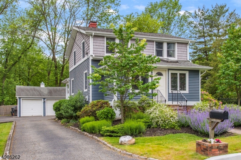 Rare opportunity in Cedar Knolls, 3 bedroom Colonial with beautiful garden and spacious yard! This updated colonial features stunning hardwood floors throughout the home, light filled living space and sitting room. Kitchen is fully upgraded with custom cabinets, quartzite counter tops, recessed lighting, tile floors and stainless steel appliances. Center island is the perfect space to entertain guests. Three bedrooms and 2 full baths complete the 2nd floor. Master Bedroom is very private with walk-in closets and upgraded shower in master bathroom. Partially finished walk out basement includes additional studio space. Home is complete with fully fenced in backyard, patio, fenced in established garden, and two car garage. This home won't last long, see it before it's gone!