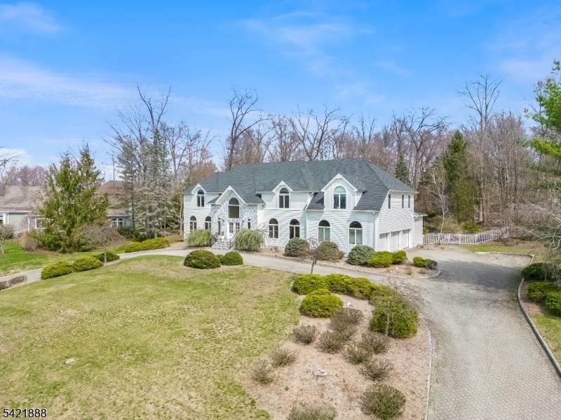 Perched on an impressive 1.33-acre property in one of Franklin Lakes? most sought-after neighborhoods, this exceptional residence at 718 High Woods Road offers approx.6500 sq.ft, the perfect blend of luxury, privacy, and timeless appeal. A circular driveway creates a grand first impression, enhancing both convenience and elegant curb appeal.Inside, a grand 2ST. foyer leads to expansive, sun-filled living spaces designed for both everyday living and sophisticated entertaining. The gourmet kitchen serves as the heart of the home, featuring high-end appliances, custom cabinetry, and a center island, seamlessly opening to an inviting family room wFPL & breakfast Rm. Formal living and dining rooms provide the ideal setting for hosting gatherings.The upper level features a spacious primary suite, offering a private retreat with a spa-like bath and generous closet space. Additional bedrooms are well-proportioned and versatile, perfect for guests or a  home offices.Step outside to your own private oasis. The beautifully landscaped private oasis is highlighted by a stunning gunite in-ground pool, creating the ultimate setting for summer entertaining or quiet relaxation. The expansive grounds offer endless potential for outdoor living and recreation.Located in prestigious Franklin Lakes, known for its top-rated schools, scenic surroundings, and convenient access to major highways, this home presents a rare opportunity to enjoy refined living in a premier location.