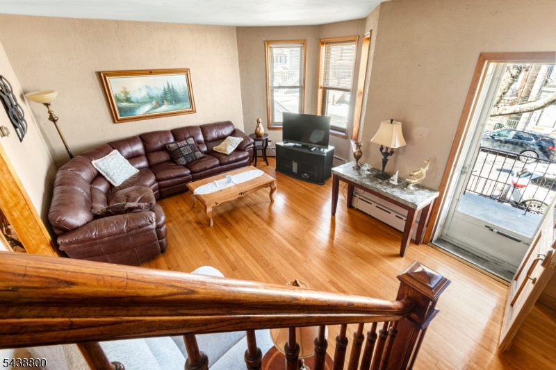 A Rare Opportunity to Create Something Special in Jersey City Heights Positioned on a full-size lot in the sought-after Western Slope section of Jersey City Heights, 304 Terrace Avenue offers the kind of opportunity that has become increasingly difficult to find a solid brick home with exceptional space, flexible living arrangements, and tremendous upside for the buyer with vision. Spanning approximately 1,730 square feet across three levels, this home features oversized windows, wood flooring,and a layout that easily adapts to a variety of lifestyles. The main living level includes a bright living room with a charming bay window, an eat-in kitchen, full bath, and mudroom with direct access to the backyard. The upper level offers two spacious bedrooms along with additional bonus rooms that can be reimagined as home offices, or expanded bathroom space. A standout feature is the fully independent ground-level living area  with  kitchen, full bath, laundry, providing valuable flexibility for guests, work-from-home needs, or recreation.. The deep backyard offers ample room for gardening, entertaining, or a private urban retreat. not a turnkey property but for the buyer who understands the value of location, square footage, and solid construction, it presents an opportunity to personalize, renovate, and build equity.  steps to beautiful parks, highly regarded schools, and instant mass transit into Manhattan, this is a chance to invest in a home and a location with lasting appeal.
