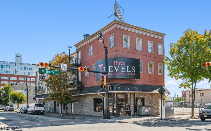 Price Adjustment to reflect a 6.25% CAP RATE. A rare opportunity to acquire a fully income-producing mixed-use property in the heart of Downtown Newark's Arena District, steps from the Prudential Center and Mulberry Commons Park. 218 Mulberry Street offers immediate cash flow with significant long-term upside in one of Newark's most active redevelopment corridors. The property features a strong commercial anchor tenant generating approximately $240,000 annually, plus four residential units above, providing a diversified income stream with total annual income of approximately $349,200 and a net operating income of approximately $291,900. Operating expenses are low, tenants pay all utilities, and the property is owner-managed. All leases are month-to-month, offering incoming ownership flexibility to lock in long-term leases, optimize rents, or reposition the asset. Located within a major redevelopment zone surrounded by substantial public and private investment, the property is widely regarded as a strategic parcel in the continued transformation of Downtown Newark. Ideal for 1031 exchange buyers, long-term hold investors, value-add strategies, or assemblage-minded buyers seeking stable income today with meaningful future potential.