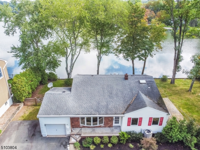LIVE THE LAKE LIFE!!! AMAZING OPPORTUNITY TO OWN ON CRYSTAL LAKE WHERE YOU CAN ENJOY BOATING, FISHING, AND SWIMMING IN DESIREABLE BERGEN COUNTY LESS THAN 1 HOUR TO NYC!! THIS 3 BEDROOM 1.5 BATH SPLITLEVEL WAS BEAUTIFULLY RENOVATED IN 2018 IS TOTALLY MOVE IN READY. THE GROUND LEVEL HAS A VERY LARGE FAMILY ROOM, HALF BATH AND LAUNDRY ROOM. HEAD UP TO THE SECOND FLOOR OPEN FLOOR PLAN WHERE YOU HAVE YOUR LIVING ROOM ANDTHE BRIGHT AND AIRY KITCHEN WITH GRANITE COUNTERTOPS, BREAKFAST BAR AND LIVING ROOM. THIRD FLOOR HAS 3 BEDROOMS AND FULL BATH WITH SKYLIGHT BRINGING IN PLENTY OF LIGHT. CLOSE TO ALL MAJOR HIGHWAYS!!