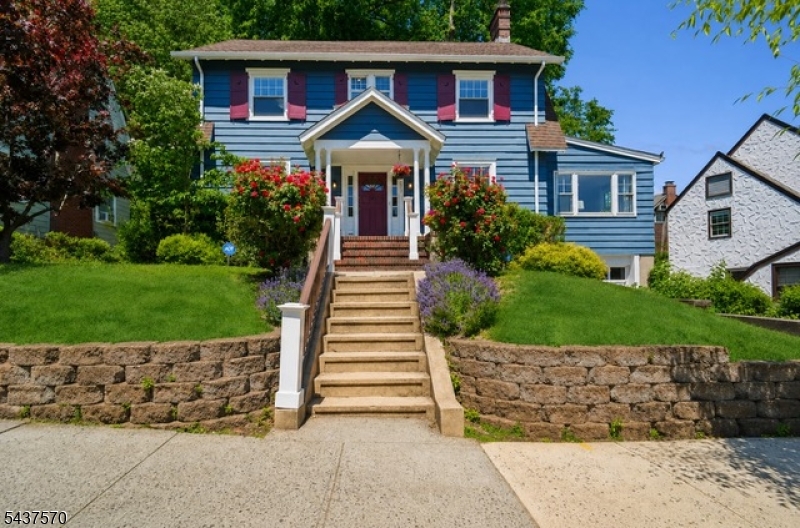 Welcome home to this picture-perfect Colonial, beautifully set on a gentle rise and filled with the charm, warmth & space today's buyers are looking for. A welcoming vestibule opens to an elegant Foyer with rich chestnut trim, hardwood floors & classic details that highlight the home's timeless character. The sun-filled front-to-back Living Rm, anchored by a decorative fireplace, offers an inviting setting for everyday living & entertaining. The formal Dining Rm is perfect for gatherings, while the spacious eat-in Kitchen features honed granite counters, tiled backsplash & views of the lush, flat rear yard. Step onto the deck for seamless indoor-outdoor living overlooking a private retreat w/ hot tub & fire pit. A window-wrapped Den w/ built-ins is ideal for a home office or playroom & Powder Rm completes the 1st level. Upstairs, the spacious Primary Suite offers a walk-in closet & updated Bath with oversized glass-enclosed shower. 2 additional Bedrooms and a full Bath complete the second floor. The 3rd floor adds exceptional flexibility with a 4th Bedroom, full Bath, walk-in cedar closet & attic storage ideal for guests or office. The finished Lower Level expands the living area w/a Recreation Rm, Powder Rm, Laundry, abundant storage & direct access to the built in one-car Garage. Freshly painted throughout, this special home blends timeless character & thoughtful improvements. Close to S. Mountain Reservation & only .6 mi to NYC direct trains & all that SO Village offers.