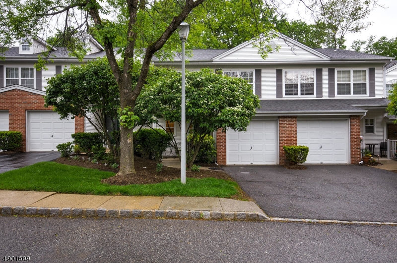 BEAUTIFULLY MAINTAINED ALPINE MODEL 2 STORY TOWNHOUSE -  CONVENIENTLY LOCATED TO EVERYTHING! Bright, spacious, welcoming floor plan on 1st level which includes wood burning fireplace! Kitchen equipped with an abundance of cabinetry and stainless steel appliances. On-grade garage and 1st floor laundry room. Sliders lead to patio facing treelined yard. Large master bedroom w vaulted ceilings & skylights. 3rd spacious room upstairs can be as bedroom, den or office. Water heater less than a year old. Pool, tennis, exercise room, walking trails..All this plus the convenience to trains, major highways and shopping!