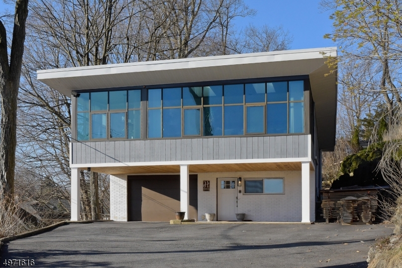 Custom home with an open floor plan, tons of natural light and amazing views of the lake. Hardwood floors, wood burning stove, fenced in private yard with pool and deck. This home is great for relaxing or entertaining. Includes lake and docking access right across the street.