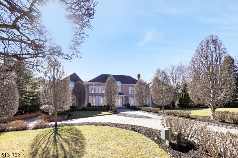 All Brick French Chateau nestled on 1 acre is located on tree-lined cul-de-sac.  The beautiful home was built by custom builders Commorata-Berardi and has exquisite detail with custom woodwork throughout.  First floor has a beautiful billiard room and library that leads to an open finished basement. The open finished basement features a movie theater with a concession stand and a gallery that would be perfect for a play area, a gym and/or a yoga studio.  The basement also has a full bathroom. The private  backyard is your own oasis with custom blue stone patios, a 300 square foot pool house consisting of a full bathroom, built-in grill, central AC and heating.  A 22 x 42 newly refurbished gunite pool is surrounded by manicured gardens and a pond.  Features of the home include a sonos sytesm, two back-up generators, five car garage and a newly updated alarm system.