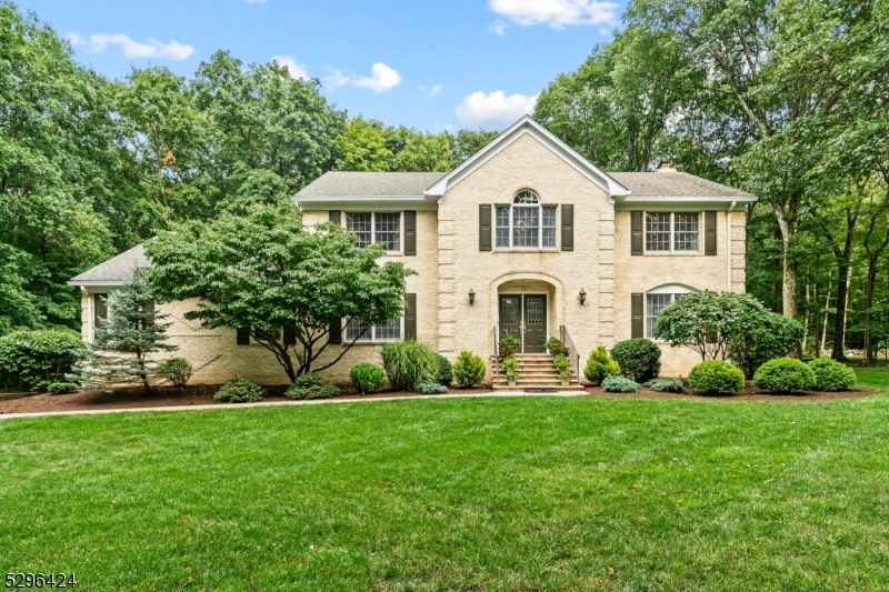 The view changes almost daily from every window at this well built and well maintained colonial situated on a FLAT lot with open rear yard (perfect for a future in-ground pool) in a double cul-de-sac quiet neighborhood. Privacy and "quiet" are insured for your future due to the adjacent 3,500 acre Mahlon Dickerson Reservation offering easy access to trails nearby. This home features real oak wood floors, solid wood and French interior doors, and stained wood trim throughout (there are even HW floors under the WTW carpet in the Fam. Rm and BR 5). The exterior features a full brick front and cedar siding on the sides and rear. You can spend the rest of your summer relaxing on the 58' deck overlooking the private rear yard or retreat to the inside with versatile floor plan including 3 living spaces on the main level. (The LR is now used as a spacious home office.) Enjoy many updates throughout including newer GE Profile and Bosch appliances. Find double closets in BR's 2, 3 and 4 while the Primary BR has a W/I plus 2 closets in the dressing room which also features a slider to a Juliet balcony. There are 7 HWBB heating zones including 1 in the basement and another in the 3 car gar fueled by a 400 gal ROTH A/G oil tank. Enjoy 2 zones of CAC in warmer months + you will LOVE the thermal Anderson Windows year round. Super convenient location just 3 miles to Main St stores, 6.5 miles to North Village, & 6 miles to Oak Ridge. Great Commuter LOCATION via Rt 15 or 23. NYC Bus available.
