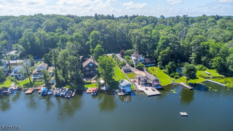 Incredible opportunity to BUILD your DREAM HOME on the East Shore of Culver Lake! These two prime parcels are ideally situated in a sought-after no-wake zone on the south end of the lake, renowned for its calm, deep waters and breathtaking sunset views. All Township and County approvals and variances are in place to build a 2 story 3 bedroom custom home with a walkout basement directly to the lake. The home is designed with 2 full baths and 2 half baths with a large first floor covered porch overlooking the lake. The design includes an 85 foot long driveway to a 2 car front entry garage. Included are the County Septic and Well approvals for installation across the street on Lot #31. All engineering has been approved and architectural plans are available. Do you want to enjoy the lake now? This lakefront lot, at #30, currently has a large concrete dock and bulkhead. The current two-level boathouse can remain during construction but must be removed after the new house is completed which will increase the views from your new home. Soak in vibrant sunsets from the dock and don't miss your chance to build the ultimate lakefront escape on one of Culver Lake's most desirable shorelines!