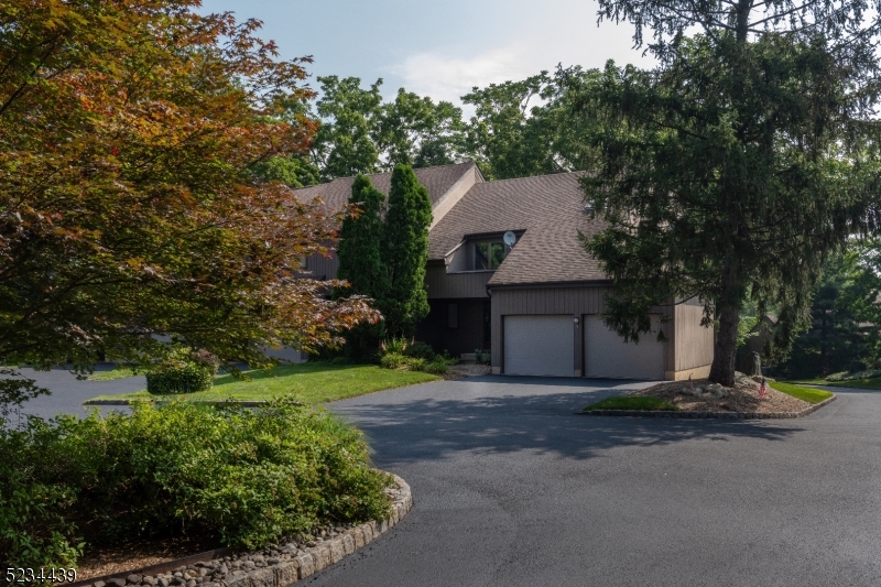 Welcome to the highly sought-after Windmill Pond community in Morristown, where you'll find this spacious 2 bedroom, 2   bathrooms townhouse awaiting your visit. Nestled in a prime location, this End Unit offers a multitude of desirable features, including three floors of living space, a rare, finished basement with huge storage space and a spacious 2-car garage. Recent updates include hardwood floors & new beautiful solid wood interior doors throughout. On the main level you'll find the formal living room and sliders that lead to a spacious deck amongst the trees.  Home also features a formal dining room and bright foyer entry.  The kitchen features counter seating, and access to a lovely open porch. On the second level the primary bedroom with an en-suite bathroom and a large Walk in Closet, a second bedroom, a full hall bathroom, and a convenient laundry room. The seating area loft overlooks formal living room with wood burning fireplace! Basement level features a spacious family room with built in shelving and an additional finished room currently used as an exercise room. There is also plenty of storage space in another large unfinished section. The Windmill Pond community pool, jogging path and shimmering pond are among the amenities. All this conveniently located near vibrant downtown Morristown which boasts many fine dining establishments, shopping, NYC Direct train, schools and more. Minutes from major highways, Rt 10, 24, 202, 53 and Interstates 287 and 80.