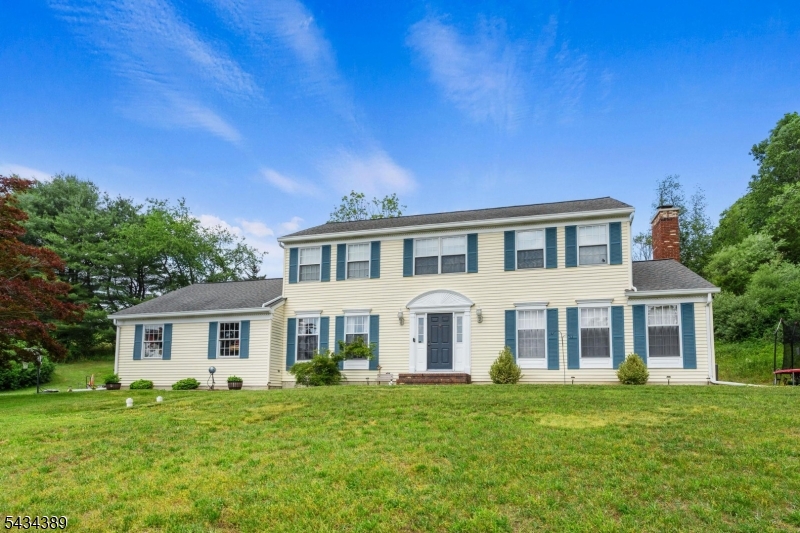 Welcome Home to this private retreat that is what you have been waiting for. Located on almost 2 acres of green land and a pond, this Beautiful 4 Bdrm, 3.1 Bath Center Hall Colonial is loaded w/ charm and character. Features include large rooms, Hardwood floors, French doors leading you into your Formal Dining room, Large windows allowing plenty of sunlight, a Family room with a wood-burning fireplace, an Eat in Kitchen w/ Granite Countertops, Breakfast Bar. Sliders to the huge deck overlooking the hills. Primary Bdrm offers a full bath and WIC. A full finished bsmt w/ several large rooms, craft room, den and a full bath. RECENT Improvements include: New A/C in 2024. New water softener. New Reverse Osmosis water system in kitchen.  New water tank, attic fan. Garage doors & Openers. New Motorized Awning w/ wind sensor(will automatically close if it is to windy). New Leaf Filter Gutters on the entire house. Additional items Seller is INCLUDING in the sale: Generator, UTV(Utility Terrain Vehicle) & plow, Washer & Dryer.. SELLERS ARE FINISHING SOME COSMETIC REPAIRS PRIOR TO PHOTOS BEING TAKEN. HOME SHOWS VERY WELL!!