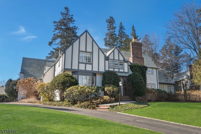 Completely renovated sun-filled Colonial/Tudor located on Summit's Northside and only 1/2 mile from Summit's downtown. A recent renovation includes  a new gourmet kitchen and all new bathrooms. The first floor is open and includes a mudroom and two possible office locations. Front and back stairs to the second floor and 5 bedrooms, 3 new full baths, a powder room and the laundry. Level fenced backyard with bluestone patio surrounded by mature landscaping.
