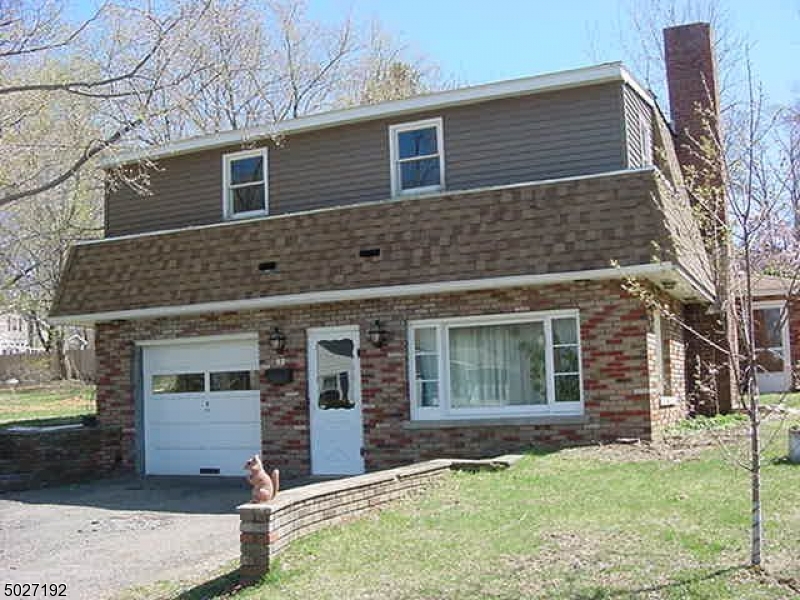 Great opportunity for first time home buyer! Property needs TLC.  First floor has spacious family room with bar and fireplace, new full bath with large tiled shower, laundry room, office. Second level: kitchen, dining room, master bedroom, office/bedroom plus sun room.  Garage narrow, compact car only. House and garage will be cleaned out prior to closing.