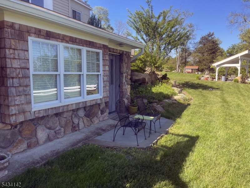Newly updated studio apartment in a peaceful country setting, surrounded by rolling hills, pastures, and mountain-view sunsets. Ground-level location in a beautifully-kept multi-family home, all utilities included with common shared washer/dryer on 2nd floor. Includes wi-fi. One pet under 50 lbs welcome. Tenants have use of impeccably maintained outdoor areas including landscaped grounds with stream-fed ponds, stonework, patios, and multiple seating areas. Common space is maintained by the owner and available for tenant use year-round. Shared driveway with assigned parking.