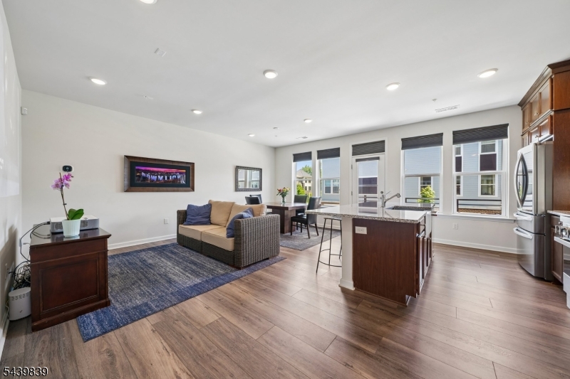 Welcome to effortless living in the heart of the vibrant Vermella community in Union. This beautiful 3-bedroom, 2.5-bath townhome offers a seamless blend of modern style and suburban convenience. From the moment you step inside the main floor, you're greeted by an airy, open layout designed for both relaxing evenings and easy entertaining. The chef's kitchen flows beautifully into the living spaces, featuring upgraded finishes that make the whole home feel fresh and sophisticated.Upstairs, the primary suite serves as a true retreat, complemented by two additional well-appointed bedrooms and a loft area that offers plenty of flexibility for a home office or guest space. This unit's location in the back of the community adds to the peaceful and quiet feel, yet you're just steps away from fantastic amenities: your own private gym, access to the Sol community's pool, recreation room, grills, and meeting spaces.The location is truly unbeatable for those who want everything within reach. You are moments away from the historic charm of Liberty Hall and the academic energy of Kean University. For commuters, the proximity to the Union train station is a total game-changer, offering a direct link to NYC for work or weekend adventures. Whether you're grabbing a coffee nearby or hopping on a train to the city, everything you need is right at your doorstep. This is more than just a townhome; it's your gateway to the best of Union.