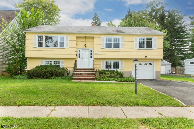 Welcome to 16 Keansburg Road in the heart of one of Parsippany's most sought out neighborhoods; LAKE PARSIPPANY!  This four bedroom, picture perfect Bi-Level features impeccable curb appeal located close to shopping and major highways, Route 287, Route 80 and Route 10.  Over-sized driveway provides parking for up four cars at once including a one car garage.  Enjoy an over-sized backyard perfect for outdoor entertaining; anything from gardening, to BBQ's or a game of catch!  The outdoor deck is perfect for outdoor dining or just enjoying quiet evenings during the Summer and Fall!  The walkout basement features sliding glass doors to the outdoor backyard; convenient access to the backyard either from the basement or from the upstairs deck!  Enjoy cooking in the bright and airy kitchen with a window overlooking the backyard.  Tons of cabinet space in this kitchen!  The formal Dining Room provides outdoor access to the back deck.  Hardwood flooring throughout the Living Room, Dr, and br's!  Open floor plan from the Living Room to the Formal Dining Room.  Three bedrooms, including the Master Bedroom and Master Bathroom Suite with hardwood flooring located on Kitchen level.  The downstairs Recreation Room features wall-to-wall all weather carpeting in addition to a fourth bedroom with wall-to-wall carpeting.  This Recreation Room is ideal for endless entertainment options.  THIS ONE WON'T LAST LONG!  Enjoy all Lake Parsippany has to offer!