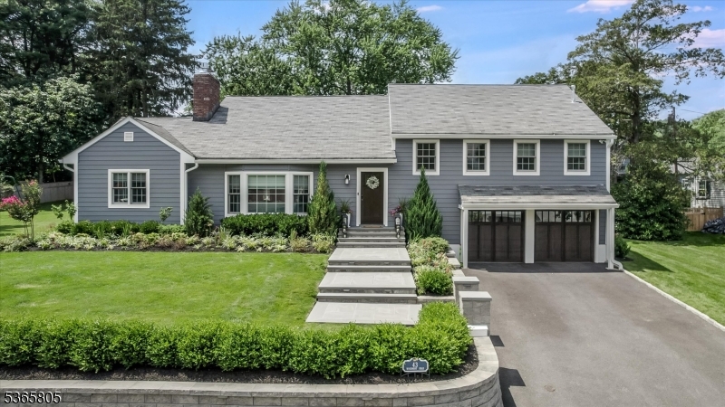 Welcome to 43 Woodmont Road in Upper Montclair a showstopping, top-to-bottom renovation on nearly half an acre, just four houses from Yantacaw Park and a short stroll to Brookdale and Tuers Parks. Every inch of this home has been upgraded with intention and high-end design, inside and out there's truly nothing to do but move in and enjoy this spectacular home in a prime location. The kitchen is a chef's dream with quartz waterfall island, farm sink, and high-end stainless appliances overlooking a beautifully landscaped, fenced backyard retreat. Entertain in style with a Trex deck with retractable canopy and lighting, paver patio with gas fire pit, outdoor kitchen with built-in BBQ and fridge, plus a Sport Court basketball court. The full interior renovation includes the kitchen, bathrooms, designer lighting and wallpaper, custom closets, Smart Home features with Nest controls, and a gas fireplace. Two bedrooms feature en-suite baths, and the layout offers both open flow and cozy spaces. All new Andersen windows, doors, Everlast siding, and bluestone walkways. Finished garage with epoxy floors, new garage doors with built-in cameras. Generator, new 2-zone HVAC, full security system, irrigation, and new sewer line round out this fully turn-key home in an unbeatable location just minutes to NYC train, bus, parks, and vibrant Uptown Montclair.