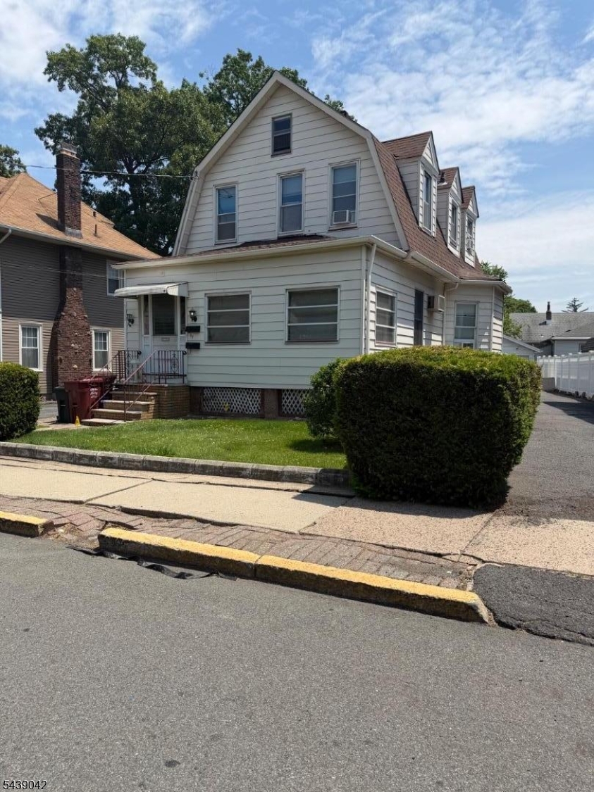 Ideal investment opportunity. First floor features a living room, kitchen, full bath and bedroom, with access to a full basement with two finished, separate rooms and laundry. There is also access out to the rear yard from the kitchen. Second floor features a kitchen, living room, 2 bedrooms, full bath with attic access. Separate gas and electric meters.  Large enclosed front porch shared by both units. Deep lot with 2 car detached garage being sold as-is. Driveway parking for 6 cars. Located within seconds of bus transportation, and located just short distances to schools, shopping and parks.