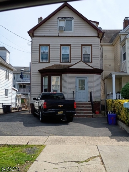 Spacious first floor one bedroom, one bath apartment in North Newark featuring hardwood floors throughout, eat-in kitchen with white cabinetry and tiled backsplash, and a bright living room with plenty of natural light. Private backyard and off-street parking included. Gas/Electric also included. Income verification required. Available immediately. No pets. No smoking.
