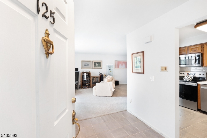 Welcome to this beautifully maintained 2-bedroom, 1-bath condo nestled in the desirable Jefferson Village section of Spring Ridge. Being move-in ready, this inviting condo offers a comfortable and functional layout. The spacious living and dining areas feature plush carpeting that continues throughout the home, creating a warm and cohesive atmosphere. The updated bathroom showcases stylish and modern finishes, while the in-unit washer and dryer provide everyday convenience. Both bedrooms offer generous space, ample closet storage, and abundant natural light. A private 1-car garage adds valuable parking and large storage room in basement. Located within the sought-after Spring Ridge community, residents enjoy a convenient lifestyle with easy access to shopping, dining, major commuting routes. Amenities include Club House, Jogging/Biking Path, Playground, Pool-Outdoor, and Tennis Courts. Whether you're looking for your first home, downsizing, or simply seeking low-maintenance living in a prime location, this exceptional opportunity is not to be missed!