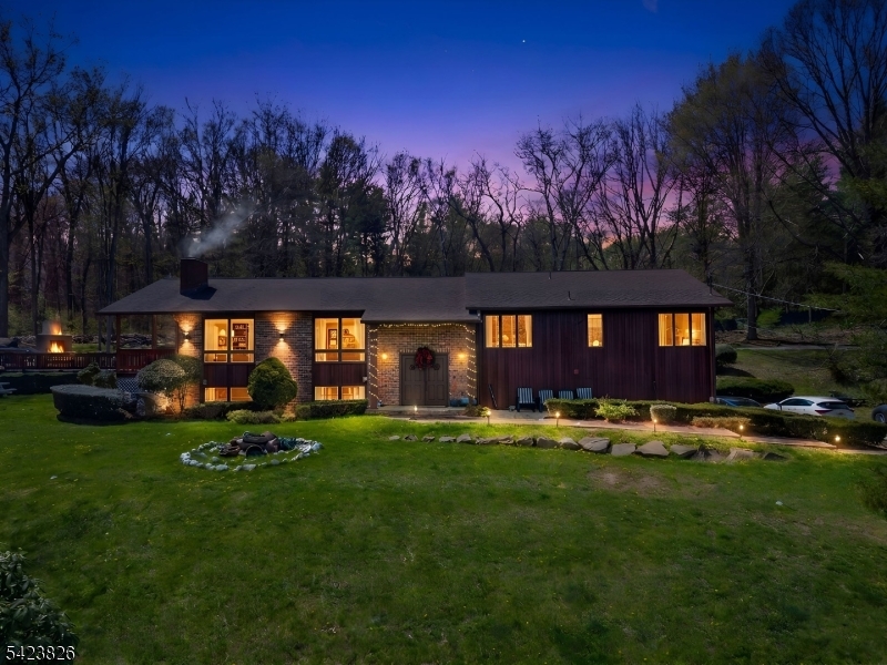 Discover this stunning custom-built home set on over 1.3 acres of beautifully landscaped property, offering serene views of Farm Crest Lake. This unique residence welcomes you with an impressive entry foyer, a spacious formal dining room, and a generously sized eat-in kitchen. The home also features two wood-burning fireplaces and a two-car garage. Nestled on expansive, park-like grounds with picturesque surroundings, this property is truly one you won't want to miss!