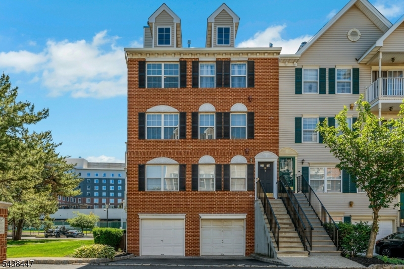 Location, location, location!-; Large 3 bed, 2.5 bath + garage corner end unit townhome in Newark's most sought after condominium, Society Hill at University Heights.-; A home that provides the best of both worlds, with a tree lined suburban feel yet minutes from all the city has to offer-; This is an upper level corner unit (with no one above you) that's bathed in natural sunlight.-; The 1st floor features a large living room (with wood burning fireplace), dining room, kitchen & half bath.-; The 2nd floor has 3 generously sized bedrooms with the primary having a private ensuite bath.-; Simply pack your bags and move right in.-; Community amenities include private security patrol, swimming pool, tennis courts, tot lot & club house; The home is located in Phase III of the community (the closest section to Rutgers University medical & undergraduate schools and NJIT)-; Easy transportation access (via light rail station that's only 2 blocks away and 4 bus lines) providing a less than 10 minute ride to downtown, home to Newark Penn Station, Whole Foods, NJPAC & Prudential Center.-; Quick & easy access to NY Penn Station, the World Trade Center & Newark Airport (via NJ Transit, PATH or express bus)-; Fun Fact - Newark provides faster access to midtown Manhattan than most outer borough locations of NYC.