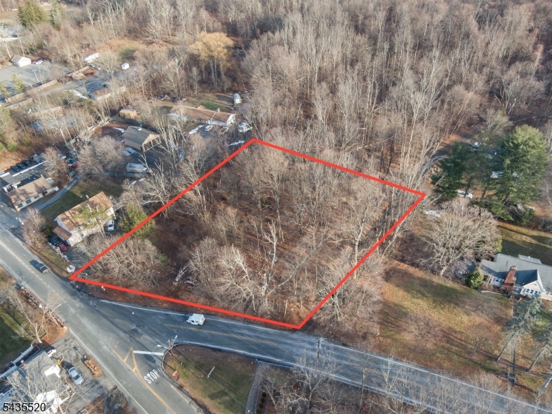 Build your dream home at 2046 Macopin Road in West Milford, NJ. This fairly level, wooded lot is ideally located at the intersection of Macopin Road and Union Valley Road, with additional frontage on Mickens Road, offering privacy, accessibility, and convenience.Previously improved with a home, the property provides a precedent for future development and potential necessary approvals. The land gradually rises from the roadway to a more level building area, allowing flexibility for custom home design, site planning, and outdoor living spaces.Zoned OT (Transitional Residential/Commercial), the town also permits a variety of uses including residential, professional offices, medical or dental offices, daycare facilities, personal services, and other neighborhood-compatible uses.Conveniently located near Route 23, this property combines a wooded setting with commuter-friendly access. Tank sweep and perc test results are available upon request for informational purposes. A rare opportunity to build, invest, or create a mixed-use property in a desirable and highly accessible West Milford location.
