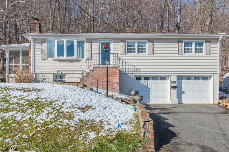 Remarkable Ranch nestled in Indian Lake! Enjoy all the advantages of 1 floor living + a full basement. The amount of flexible living space is impressive. Spacious eat-in-kitchen, bright LR w/WB fire place, protected HW under carpet throughout. Finished BSMT w/FR, laundry, plumbing for 2nd bath & garage entrance. Tons of natural light- move-in condition!!! Lots of storage in BSMT, attic & 2 car garage. Plenty of parking. Extremely well-maintained & cared for by same owners for 40 yrs. If the house isn't perfect enough, you will fall in love w/the beautiful, private wooded backyard & screened-in porch. Located only a few min drive to NYC Direct train & close to Rt 80, 10, 46, 287. Great schools. Located in heart of Indian Lake which offers 3 beaches, clubhouse, bar & year-round activities. Motorboats allowed!