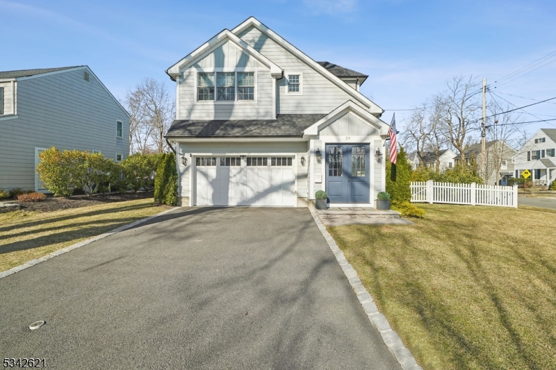 Better than brand new, this exceptional newer construction colonial offers the perfect combination of style and function. High ceilings, custom millwork, superior finishes, and abundant natural light are complemented by thoughtful enhancements throughout the home. A welcoming foyer has a sophisticated and sunlit open staircase. The first level features a floor plan that is ideal for entertaining and daily living, with a dining room, living room, and a family room with a gas fireplace. The eat-in cooks kitchen, with stainless steel appliances, quartzite countertops, and a large center island, leads to a paver patio and an expansive fenced-in back yard. A powder room, mud room, and entrance from the attached two-car garage complete the first level. There are four spacious bedrooms and three bathrooms, plus a convenient laundry room, located on the second floor. The luxurious primary suite has a walk-in closet, custom built-ins, a tray ceiling, and an adjacent spa-like bathroom with a soaking tub and an oversized shower. The lower level includes a bonus room/office, a full bathroom, a generously-sized recreation room with a wet bar, and storage and utility spaces. Equally impressive is the home's location, just .03 miles from Milton Elementary School and half a mile from downtown Chatham and the NJ Transit train station providing service to midtown Manhattan.