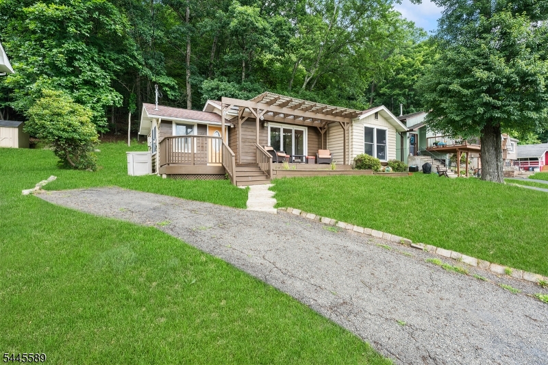 Welcome to Seneca Lake! Located right between Lake Mohawk and Lake Hopatcong. Close to Sparta downtown with many popular restaurants, shopping, parks, and other activities. This amazing lake community is a great place to call home. This lake provides a beach, swimming, boating, fishing, a playground, and clubhouse! Take a stroll down to have dinner around the corner at the famous Andre's Lakeside Dining, or spend a day having fun at popular Tomahawk Lake. The home has an inviting bright and functional layout for every day living. Spacious kitchen living area with a lot of natural light. This house has a covered front porch to enjoy the lake and a back deck too! Schedule your tour today!