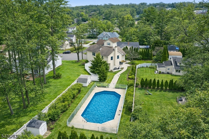 Hidden at the end of a quiet cul-de-sac, 40 Catherine Court is the kind of home that feels straight out of a storybook. Set on a sprawling lot with fairytale-like grounds, this one-of-a-kind property offers nearly 2,800 square feet of living space along with a private enclosed in-ground pool that creates your own resort-style backyard retreat. Inside, the home features hardwood floors and a warm, inviting layout designed for both everyday living and entertaining. The cozy family room with fireplace, spacious living and dining areas, and kitchen with breakfast bar all flow seamlessly together. Upstairs, you'll find two spacious bedrooms plus a generous primary suite with its own full bath. A versatile game/leisure room offers endless possibilities   perfect for a media room, playroom, home office, fitness space, guest suite, or additional living area. With its expansive layout, beautiful setting, and incredible outdoor space, 40 Catherine Court offers a rare opportunity to enjoy comfort, character, and a lifestyle that's truly hard to find.