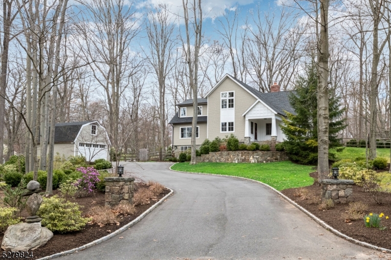 Totally remodeled an expanded unique home on 1.5 wooded acres in Convent Station.  Classic styling combined with a modern layout and an abundance of windows offering natural light and scenic views. Two primary bedrooms, one on the first floor and one on the second floor, each with two walk-in closets and en-suite bathrooms. Custom California closets. The breathtaking kitchen has marble countertops, a huge center island, Wolf 48" gas range with 8 burners and two ovens, TWO 36  Sub-Zero PRO refrigerators, TWO Miele dishwashers, and a large eating area with sliding doors offering views of the serene manicured yard and patios. The large butler's pantry rivals many kitchens, with a double drawer dishwasher for your glassware, dual zone wine/beverage fridge, sink, and loads of counter and cabinet space. The spacious living room and family room both have fireplaces. The lower level sits above grade on two sides with full-sized windows and outside access, which includes a large space for a media room or game room, a full bathroom, a mud room with walk-in closet, a wine cellar, and lots of storage space. The gorgeous property features beautiful landscaping and a fenced-in backyard with two reclaimed bluestone patios, stone fireplace and brick BBQ.  The two-story, 3+ car garage offers room for cars, storage, and other recreational uses. 3/4 mile from Ginty recreation complex. 2 blocks to Loantaka Brook Reservation. 1.5 miles from downtown. 3/4 mile from direct train to NYC.
