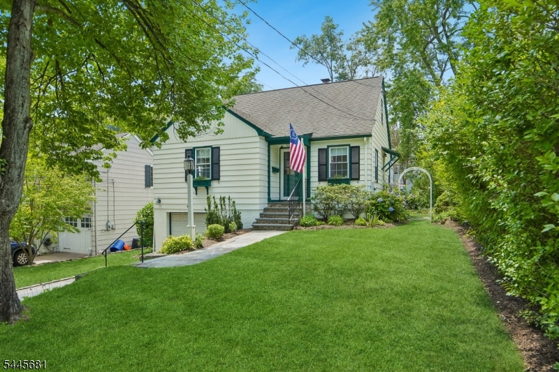 Set on one of Madison's most beloved streets in the highly sought-after Knollwood section, this immaculately maintained and thoughtfully updated 3-bedroom, 3 full-bath home offers exceptional curb appeal with charming wood shingles and a flexible, move-in-ready floor plan. Just a short walk to downtown Madison, top-rated schools, recreation facilities, the community pool, shopping, dining, and NJ Transit to NYC, this home perfectly blends timeless character with modern updates. The kitchen features stainless steel appliances, tile flooring, and a stylish backsplash. The spacious primary suite, renovated bathrooms, finished walk-out basement with full bath, and private backyard with patio, arbor, and storage shed complete the home, making it both outstanding for everyday living and entertaining. Extensive updates since 2022 include refinished hardwood floors, renovated kitchen and baths, new flooring throughout the second floor and basement, recessed lighting, custom closet system, updated lighting fixtures, interior painting, and a professionally painted exterior and shed. A rare opportunity to own a meticulously updated home in one of Madison's most coveted neighborhoods.