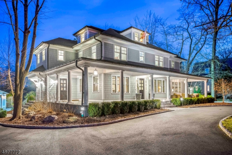 Indulge in all the amenities this totally renovated 6 bed, 5.1 bath colonial offers. Superior construction & attention to detail were the focus of this 2014 total renovation & addition. Modern details, appointments and functionality are accentuated. A custom designed kitchen with marble counters opens to a breakfast area & family room with fireplace & coffered ceiling. The 1st floor features an office or den with gas fireplace, living room, dining room, mudroom & large food & butlers pantry. Luxurious master suite with a large walk-in closet & spa like en-suite bathroom. Step outside to a wrap around covered front porch bluestone patio with jacuzzi, 2 detached two-car garages accessed on either side of circular driveway. Located on an acre of property, close to top-rated schools, town and train.