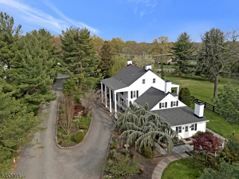A once-in-a-lifetime opportunity awaits! nestled on nearly 5 acres of rolling, picturesque land, this private estate offers a rare blend of timeless charm, modern versatility, and exceptional value. A true gentleman's farm, it balances serene country living with exciting potential?whether as a cherished legacy retreat, an income-generating property, or a future development with R-40 zoning allowing subdivision into 4?5 lots. The stately 1800s main home radiates warmth with original pumpkin pine floors, five spacious bedrooms, three full baths, and inviting outdoor spaces including a front porch and back patio perfect for gathering. A partially finished basement adds room for recreation or storage. Adding remarkable flexibility, a private two-bedroom, two-bath cottage with its own driveway provides space for separate living quarters, a home office, guest house, or rental income. Equestrians and hobby farmers will delight in the heated three-stall barn and fenced paddocks, creating the perfect setup for animals or storage. Here, every detail invites you to imagine a life of comfort, connection, and opportunity, all just minutes from highways, shopping, and local amenities. This is more than a property, it's a lifestyle, an investment, and a rare chance to own a piece of history.