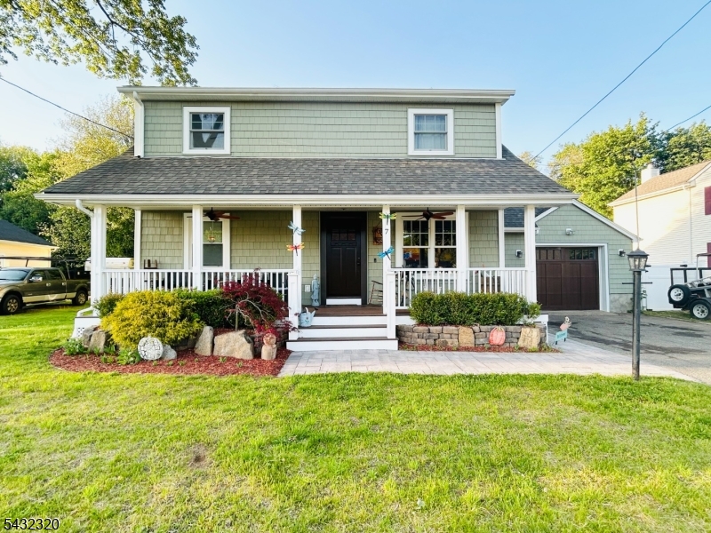 Amazing! This reno almost Tripled the SQ'. Home Rocking-chair front porch living a reminder of quieter, easier days. Just bring your favorite chairs, pour a glass of lemonade, and enjoy the simple charm this home offers. Lovingly renovated (re-built) from top to bottom, this former Cape Cod is now a 2 story classic colonial. You'll appreciate the beautiful hardwood floors, updated finishes, and thoughtful details throughout and the storage-so much storage. The garage is the only original part of the home. The fenced yard is perfect for pets, play, or gardening and it even features a custom brick fireplace, ideal for cozy evenings outdoors. This property is also known locally as the home of the largest pumpkin ever grown in NJ weighing in at 1,674 pounds, adding a fun touch of community charm. Super easy commute to Routes 45, 10 & 80