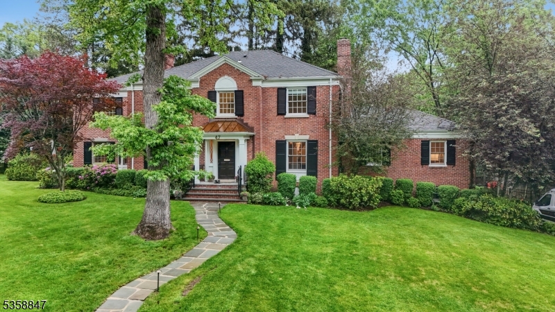 Be prepared to fall in love with this brick-front Center Hall Colonial that is renovated to perfection, set on .44 acres of lush property in the heart of Short Hills, just blocks to town, schools & train stations. Ideal floor plan w/ formal living room w/ FP, dining room, stunning new gourmet eat-in kitchen w/ Quartzite natural stone countertops & 2 dishwashers,  Miele & Fisher Paykel, Subzero refrigerator/freezer, Wolf 6 burner range, Wolf double ovens, totally open to family room w/ high ceilings.1st floor home office w/ Quartzite natural stone countertops, new custom built-ins, media room w/windows & french doors overlooking park-like property w/ private landscaping & patio area w/ new summer kitchen & fire pit. Formal entrance hall & beautiful powder room complete the 1st level. The 2nd level has luxurious Primary Suite w/ walk-in custom closet & spa-like bath w/ jetted tub, stall shower & radiant heated floor, 3 more large bedrooms & 2 more new full baths. Beautifully finished LL w/ recreation room, bedroom, full bath & laundry & mudroom w/ new custom cubbies & access to heated 2-car garage w/ Tesla charger. Amenities include sound system in most rooms & patio, Smart Home features, new state of the art lights, & built-in Generac generator. Ideal location on a quiet street walking distance to the Short Hills Train Station. Bus service to highly rated Hartshorn. This great Short Hills home is the dream home you've been waiting for. Low Taxes! Plenty of room for a pool.