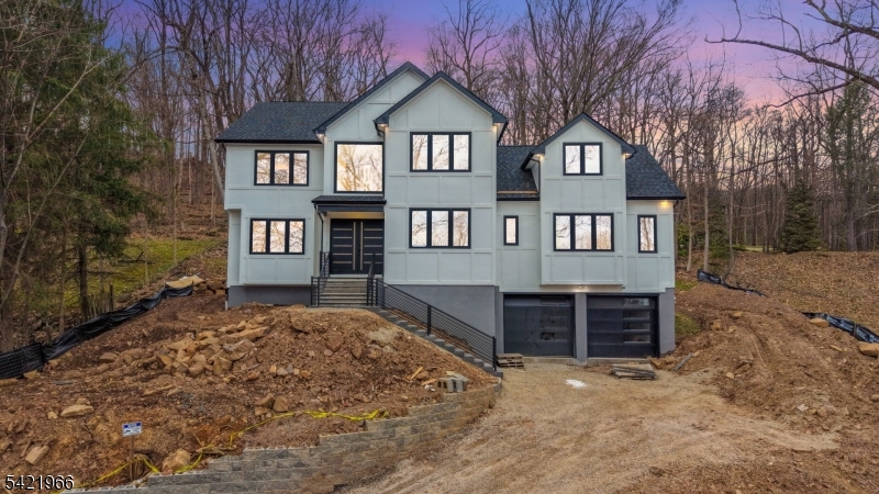 NEW CONSTRUCTION! Quality finishes and attention to detail throughout this stunning home set on over 1.5 acres with breathtaking mountain views. This impressive residence features 6 bedrooms, 6 bathrooms, and a full finished basement.Set back approximately 100 feet from the road, the home offers a spacious wooded backyard and excellent privacy in one of Montville Township's most sought-after communities.The first floor features a grand two-story entry foyer, family room with fireplace, formal living and dining rooms, a guest suite, and a second bedroom or study with a full bath. The beautiful two-tone kitchen offers a center island, large walk-in pantry with fridge and sink, double oven, wine fridge, sliders to the backyard, and a stylish powder room.Upstairs is the luxurious primary suite with walk-in closet and full bath, plus three additional bedrooms, two full bathrooms, laundry room, and a large bonus room.The fully finished basement includes a half bath, mud room, and ample storage.Additional features include gleaming hardwood floors, extra insulation, oversized custom windows providing abundant natural light, and energy-efficient UV-protected glass, irrigation system front yard, sound proofing between first and second floor.Taxes not yet assessed. Floor plan and square footage are approximate.Enjoy top-rated schools, great restaurants, and easy access to highways, buses, and trains to NYC. Just 5 minutes to the NYC bus and Towaco Train Station. East-facing home.